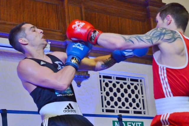 Action from Dan Meins (left) against Sergej Fomin. Photo: David Lowndes.