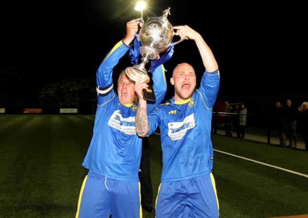 Peterborough Sports pair Karl Gibbs (left) and Lewis Webb with the Hinchingbrooke Cup. Photo: Tim Gates.