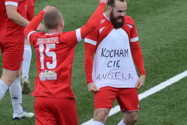 Polonia celebrate a goal against Spalding with an 'I love you Angela' message. Photo: David Lowndes.
