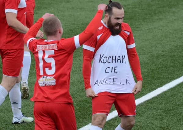 Polonia celebrate a goal against Spalding with an 'I love you Angela' message. Photo: David Lowndes.