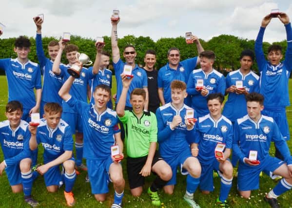 Malborne celebrate winning the Youth League Under 15 Division Two championship with their sponsor Joseph Valente, who owns and runs Impra Gas and who won Alan Sugar's 2015 Apprentice title. Picture: David Lowndes