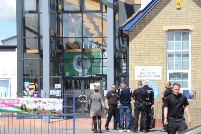 Investigators entering Discovery Primary School