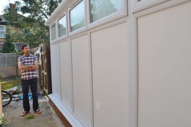 Tahir Javed of Bourges Boulevard having problems with his neighbour's conservatory EMN-160513-191524009