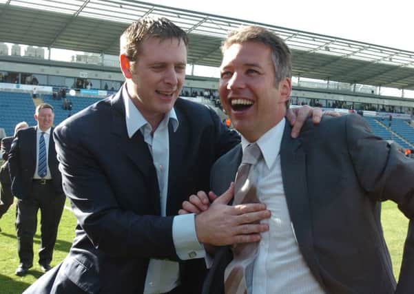 Darragh MacAnthony and Darren Ferguson celebrate promotion to the Championship after a 1-0 win at Colchester.