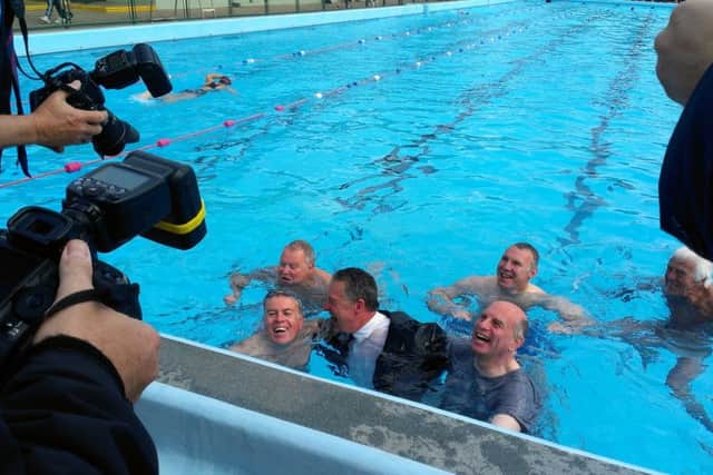 Mayor of Peterborough Cllr David Sanders and swimmers in the Lido