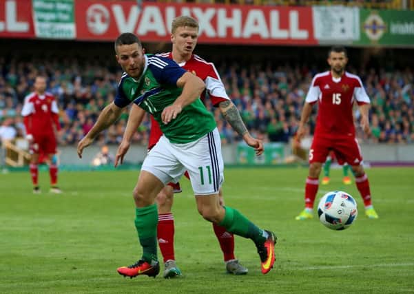 Northern Ireland's Conor Washington (left) and Belarus' Nikita Korzun battle for the ball during the International Friendly at Windsor Park, Belfast. Picture: Niall Carson/PA Wire.
