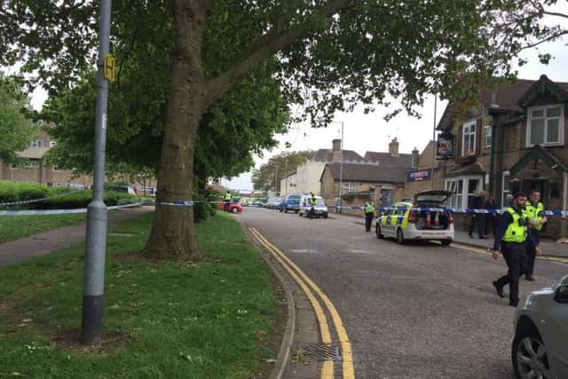 Police at the scenen of an incident at the Swiss Cottage in Peterborough