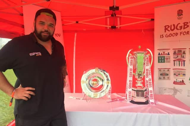 Tournament organiser Sam Sergeant with the Six Nations and Triple Crown trophies which were on display at the tournament.