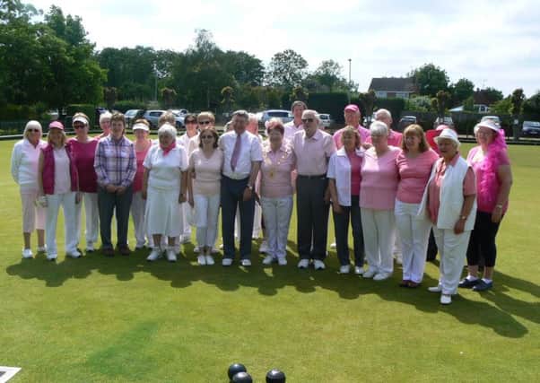 More than Â£300 was raised for Cancer Research UK following the Huntingdonshire Bowls Presidents Day at Yaxley hosted by county president Freda Thomas, who asked all guests to wear something pink.