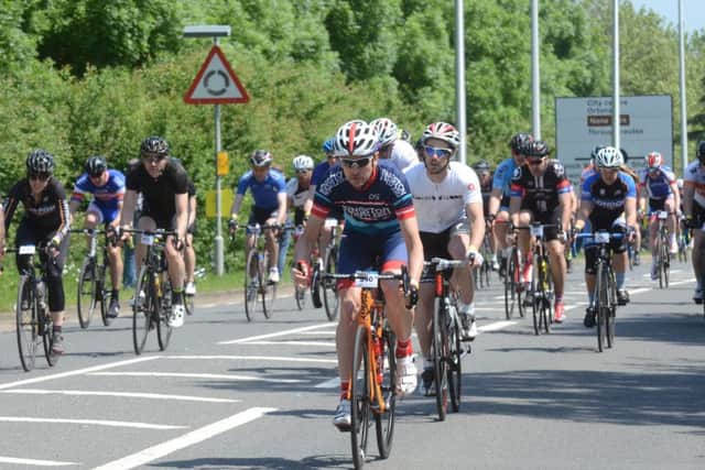 Action from the Tour of Cambridgeshire Gran Fondo start outside the East of England Showground on Oundle Road.