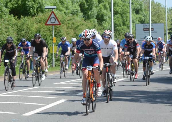 Action from the Tour of Cambridgeshire Gran Fondo start outside the East of England Showground on Oundle Road.