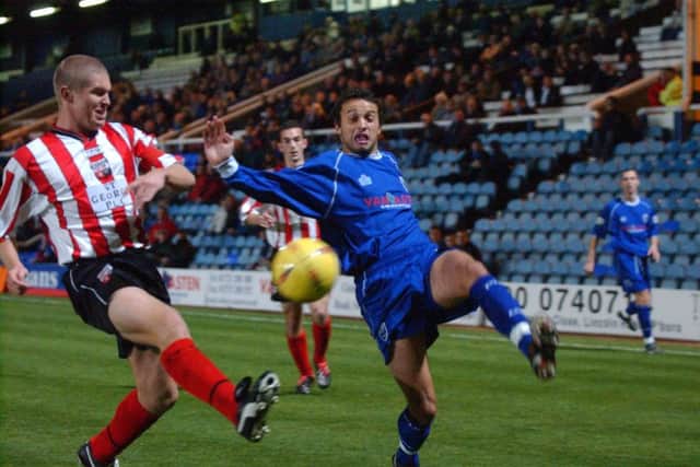 Gareth Jelleyman (blue) in action for Posh.