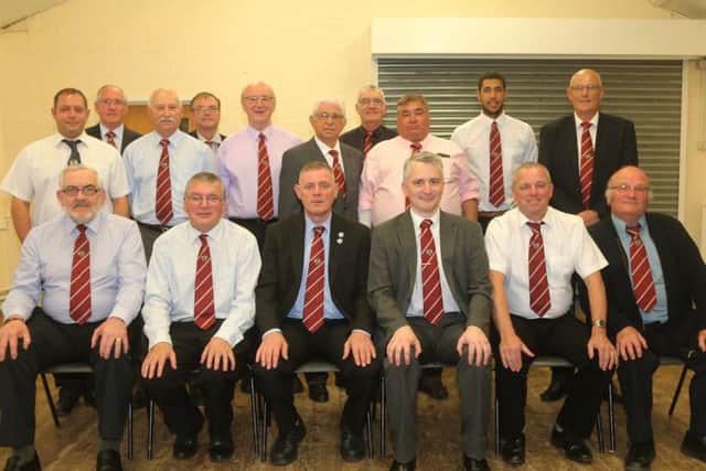 The members of the Peterborough Football Association line up for the camera at their annual general meeting . From the left are, back, Tony Nash , Robert Windle , Ray Johnson, Ashsley Baldock-Smith , Derek Gibson, middle, Les Hutchings , George Wilson, Mervyn Cowdell, Mario Storti, Stan Cox, front, David Stapleton, Paul Clarke , Clive Wilson, Paul Redgate, Mark Chambers and Peter Camm. Picture: RWT Photography