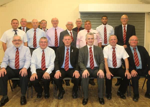 The members of the Peterborough Football Association line up for the camera at their annual general meeting .  From the left are, back, Tony Nash , Robert Windle , Ray Johnson, Ashsley Baldock-Smith , Derek Gibson, middle, Les Hutchings , George Wilson, Mervyn Cowdell, Mario Storti, Stan Cox, front, David Stapleton, Paul Clarke , Clive Wilson, Paul Redgate, Mark Chambers and Peter Camm. Picture: RWT Photography