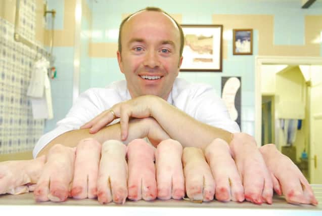 Andrew Frank of Frank Bros Butchers on Lincoln Road, Peterborough. Pictured with pigs trotters.