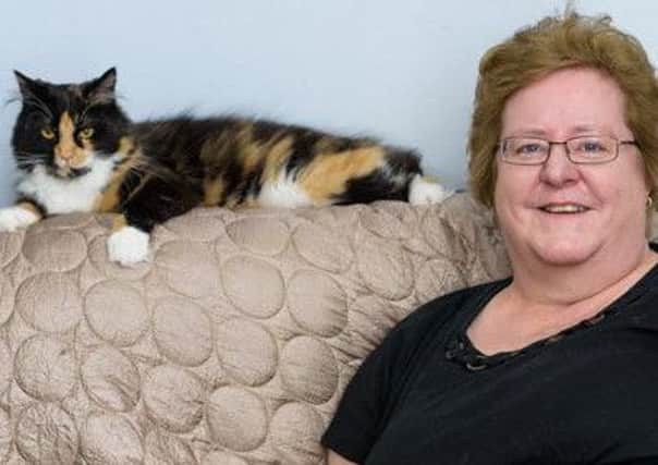 Tracey Jessop-Thompson and her cat Jessie - Photo credit - Georgi Mabee - Caters News