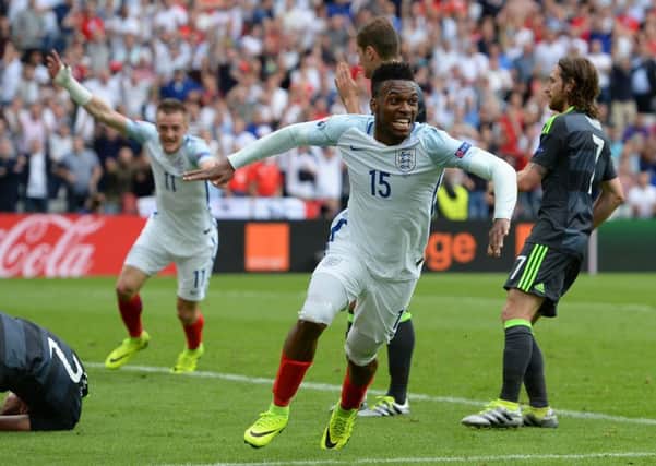 Daniel Sturridge celebrates his winning goal for England against Wales.