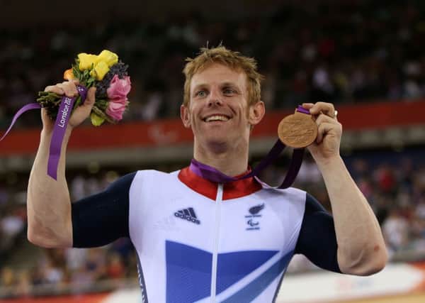 Jody Cundy celebrates winning a bronze medal at the Velodrome in the Olympic Park, London, in 2012.