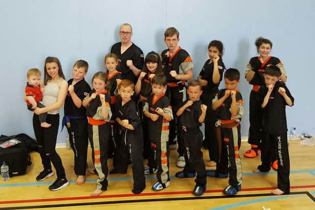 Memebers of the Hicks Karate School who did well in the British Championships. From the left they are, back, David Cairns, Jake Peppercorn, Elise Ward, Atlanta Hickman, middle, Jolie Franks, Jazmyn Popat-Evans, front, Katie Leferve with Nique Popat-Evans, Warren Bothamley, Lucy Hicks, Ginge Popat-Evans, Denas Jankauskas, Junior Crozier, Braydon Popat-Evans and Arron Leonard