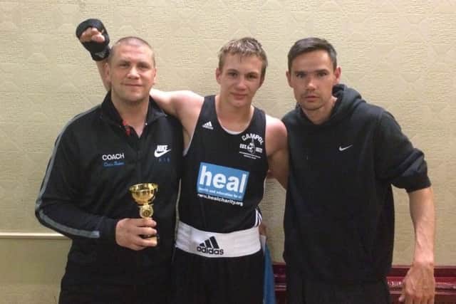 Artur Tomasevic with coaches Chris Baker (left) and Marc Burchett.