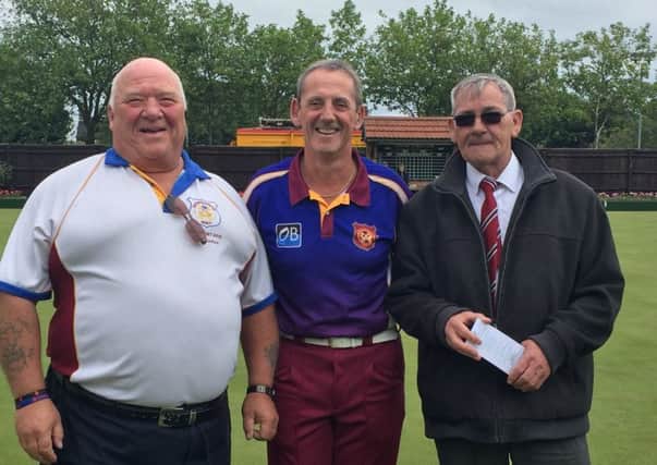Trevor Collins (centre), who made his 100th Middleton Cup appearance on Saturday, is pictured with Hunts team manager Bob Morton (left) and county vice-president Ray Keating.