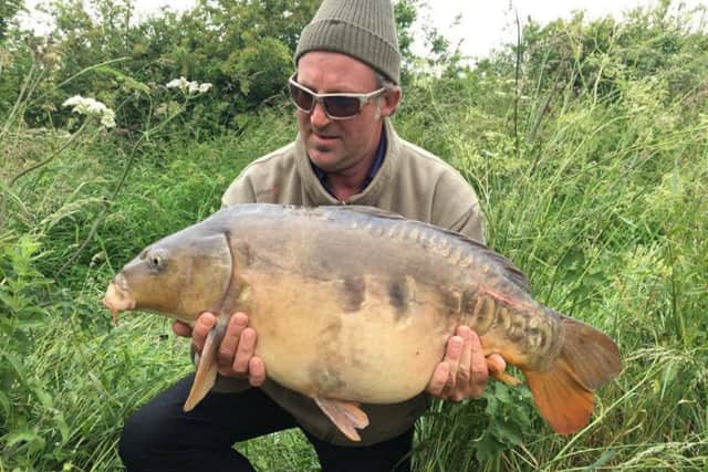 Angus Nicholls with his 28lb carp.