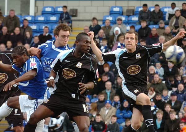 Charlie Lee heads the winning goal for Posh in their last competitive meeting with Northampton Town in March, 2009. Photo: David Lowndes.