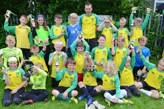 Darren Gibbons with members of his goalkeeping school.