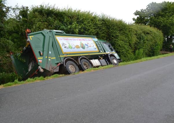 OFF-ROAD NOTICE: A bin lorry stuck in a ditch off the A16 in Mill Drove North, Cowbit.