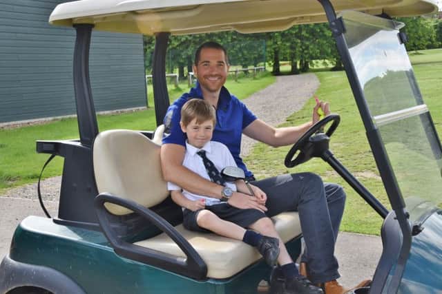 Five year-old golfer Bobby Moore practicing at Thorpe Wood golf course before he leaves for a golf tournament abroad. He is pictured with his dad Rob Moore EMN-160627-224150009