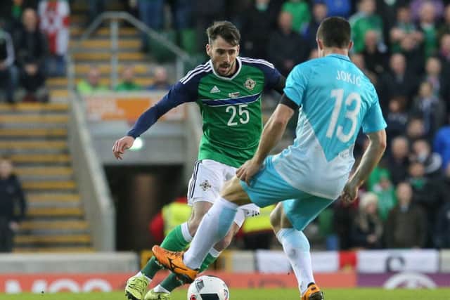 Michael Smith (left) in action for Northern Ireland.