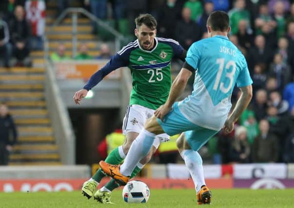 Michael Smith (left) in action for Northern Ireland.