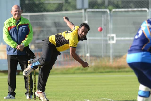 Balaji Ganesan bowling for Peterborough Town against Bourne in the Jaidka Cup Final. Photo: David Lowndes.