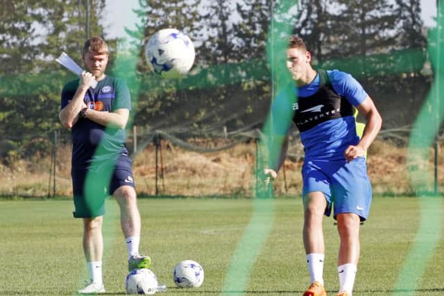 Matty Stevens training in Portugal under the watchful eye of manager Grant McCann.