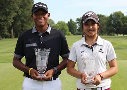 American Junior Golf Association boys champion  Robin Williams (left) with girls winner Kanyanat Saithip of