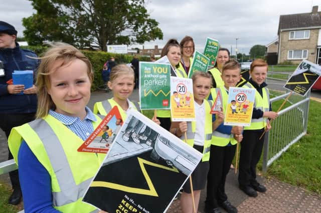 Pupils from Southfields Primary School, Stanground protesting about parking around the school EMN-160507-085607009