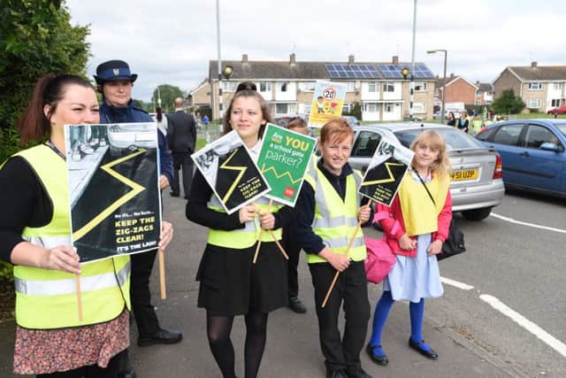 Pupils from Southfields Primary School, Stanground protesting about parking around the school EMN-160507-085725009