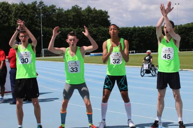 Karim Chan (second right) celebrates with his relay mates.
