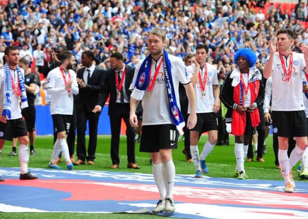 New Posh manager Grant McCann leads the celebrations after the JPT Final win at Wembley in 2014.