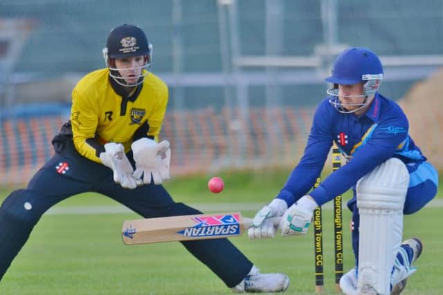 Bourne captain Peter Morgan batting against Peterborough Town in the abandoned Jaidka Cup Final. The wicket-keeper is Chris Milner. Photo: David Lowndes.