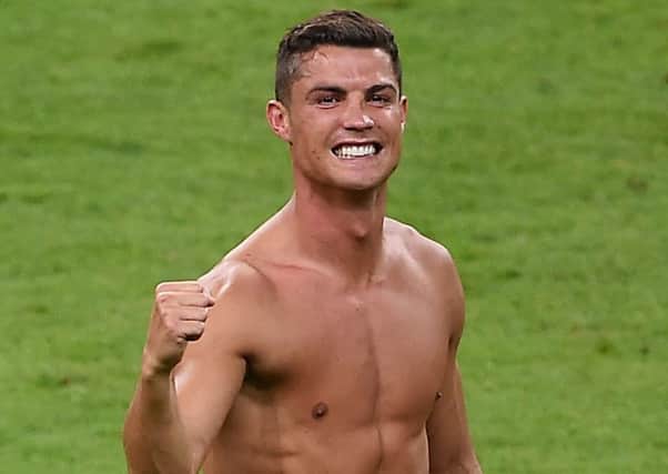 Cristiano Ronaldo celebrates Portugal's success at the Euros.