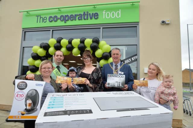 Hempsted Co-op celebrating the new store opening. From LtoR: Urszula Fox (coffee machine), Stuart Mott (Store Manager), Samantha Hewitt (TV), Mayor of Peterborough, Councillor David Sanders and Carly Duff (smoothie maker).