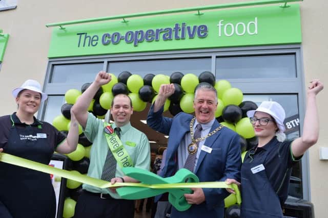 Hempsted Co-op celebrating the new store opening.