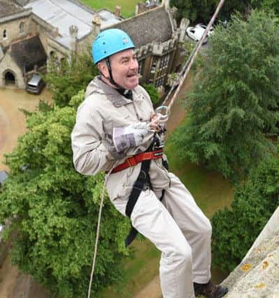 Charity abseil, at Peterborough Cathedral.  Canon Bruce Ruddock EMN-160907-175420009