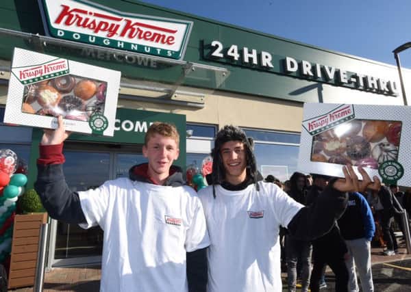 Oliver Cullen and Samuel Coward at the opening of Krispy Kreme Doughnuts in Hampton this morning