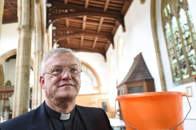Revd. Ian Black at St John's Church, Cathedral Square -  now have new roof, no more need for buckets EMN-160713-154215009