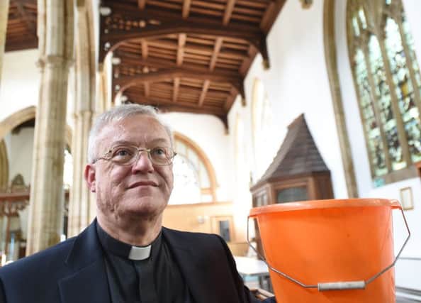 Revd. Ian Black at St John's Church, Cathedral Square -  now have new roof, no more need for buckets EMN-160713-154215009