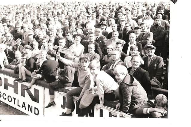 Posh fans on the Glebe Road terrace. Can you date the picture?