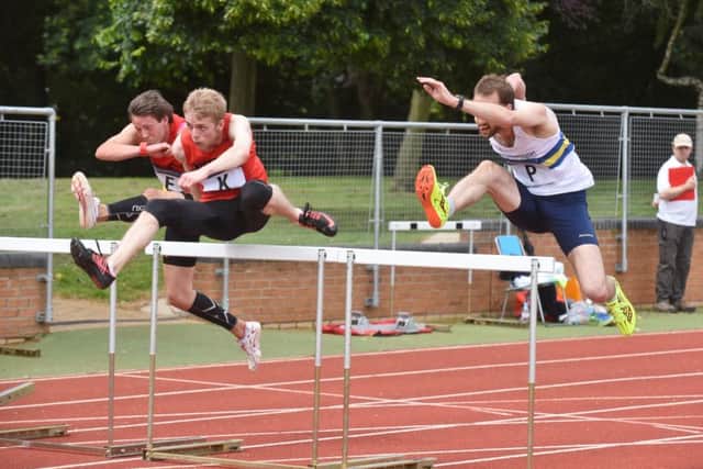 Matthew Dalton (right) in action for PAC in the 110m hurdles last weekend. Photo: David Lowndes.