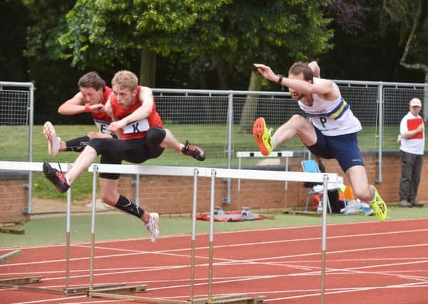 Matthew Dalton (right) in action for PAC in the 110m hurdles last weekend. Photo: David Lowndes.